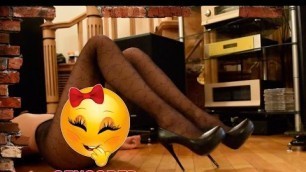 'Legs show in black fashion print pantyhose and high heels.'