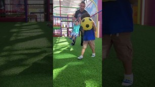 'playing soccer at kids empire'