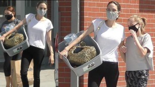 Angelina Jolie and her daughter Vivienne visit a pet store