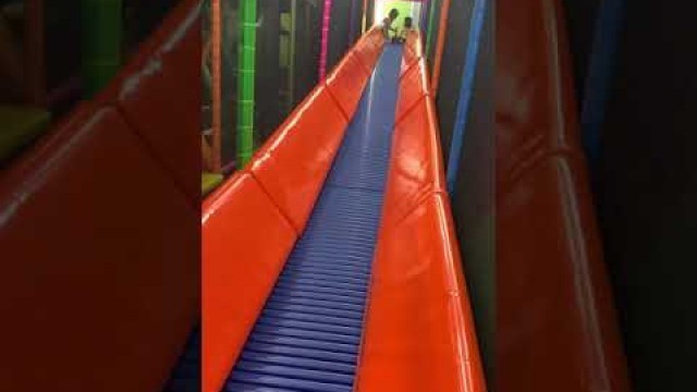 'Enjoying Slide in Kids Empire - Houston'