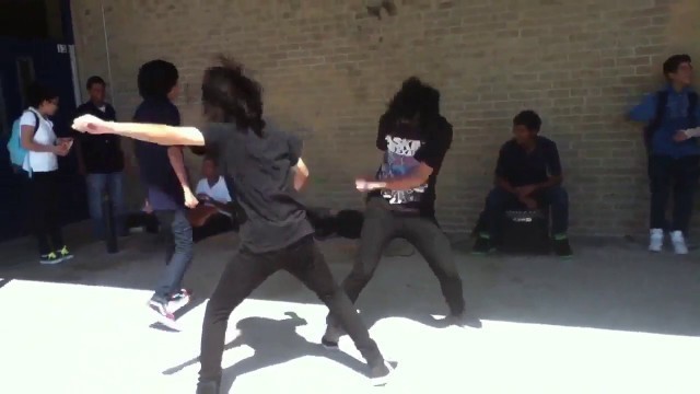 'Emo kids dancing at school'