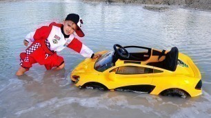 'Nikita ride on children\'s car and stuck in a puddle'