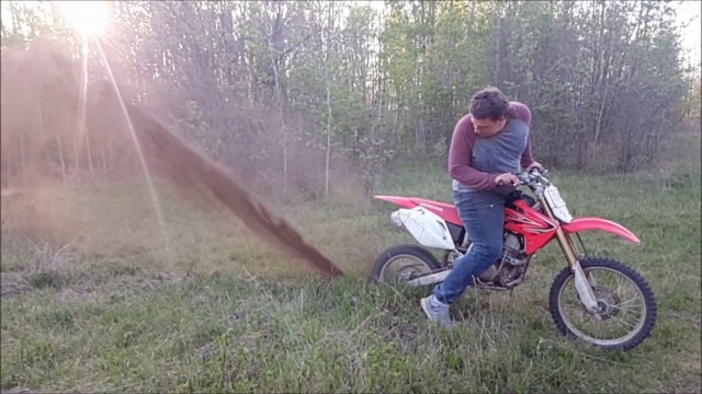 Fat kid does epic burnout on anthill with dirtbike