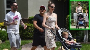 Behati Prinsloo & Adam Levine looked happy to be taking their eldest child Dusty for a stroll in LA