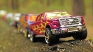 'Cars in the Forest Transported by Dump Truck Toy'